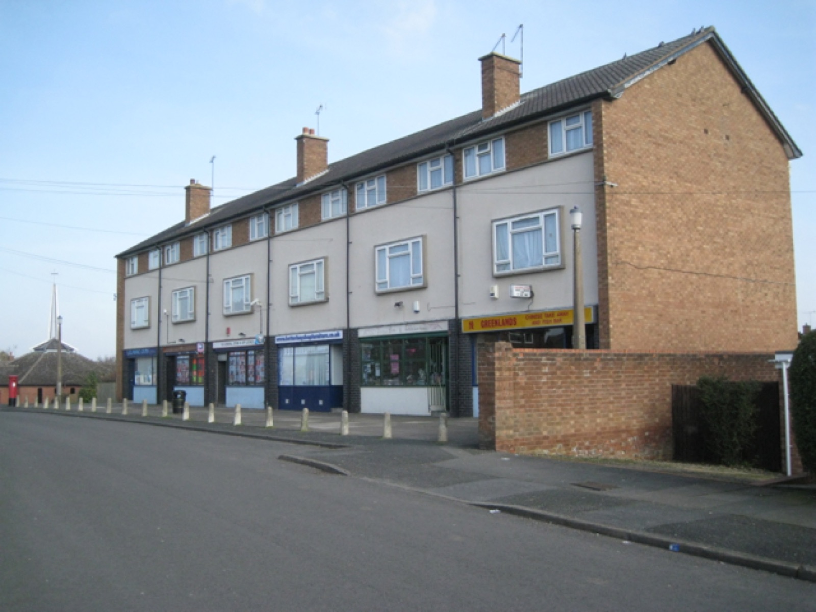 A row of local shops with flats above on Dowler's Hill Crescent